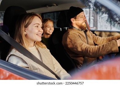 Family of three travelling by car - Powered by Shutterstock