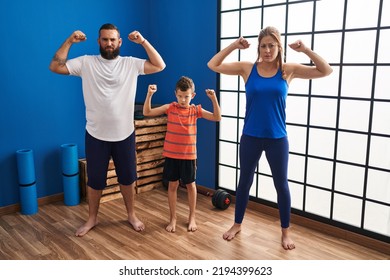 Family Of Three Wearing Sportswear At The Gym Clueless And Confused Expression. Doubt Concept. 