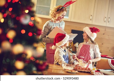 Family Time- Children And Mother Making Christmas Cookies
