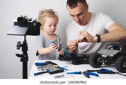 Family Time: Dad And Daughter Repair The Rc Radio Controlled Buggy Car Model And Lead A Video Blog.