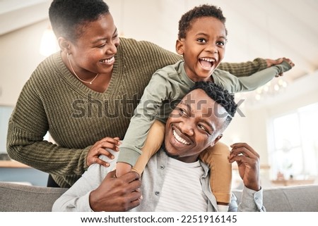 Family time is for laughter and fun. Shot of a happy young family playing together on the sofa at home.