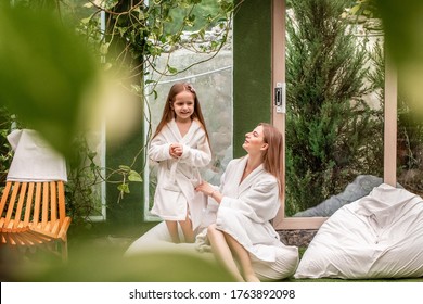 Family Time, Spa And Beauty, Mothers Day. Mom And Daughter In Beautiful Spa With Big Garden View Window. Kids Hygiene.