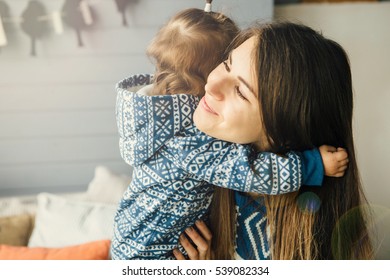 Family time.Happy mother  hugs with her  child
