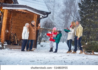 Family Together Celebrating Christmas At Home
