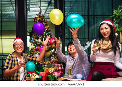 Family Together Enjoying Christmas And New Year Party Holiday Celebration.