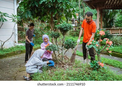 Family Togetherness Cleaning And Caring For Ornamental Plants