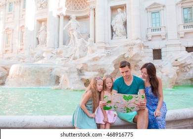 Family With Touristic Map Near Fontana Di Trevi, Rome, Italy. Happy Father And Kids Enjoy Italian Vacation Holiday In Europe.