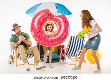 Family Of Tourists With Flotation Ring, Camera And Water Gun Isolated On White, Travel Concept