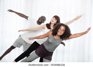 Family Training Yoga On The Mat At Home