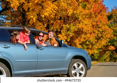 Family Travel In Car On Autumn Vacation, Happy Parents And Kids Have Fun In Trip, Insurance Concept
