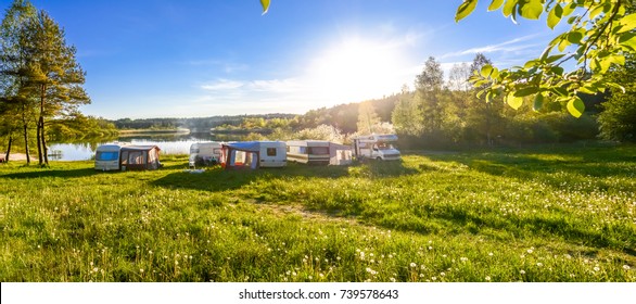 Family Travel Concept. Caravans And Camping On The Lake.