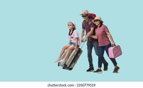 Family Travel Concept, Full body Happy asian family vacation, Father, mother and little daughter sit on suitcases ready for vacation trip, isolated on pastel plain light blue background - Powered by Shutterstock