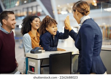 Family, travel and high five, child and parents with airport staff, happiness and vacation, ready for adventure. Happy people, diversity and freedom, support with holiday abroad, flight and airplane - Shutterstock ID 2262688023