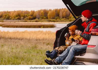 Family Traveling By Car Having Rest And Looking At Beautiful Fall Landscape