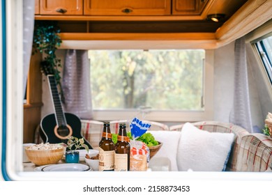 Family Traveling In Camper. Inside House On Wheels,trailer,motor Home. Dinner Table.Food,guitar. Romantic Road Travel,freedom Life.Campsite Overnight,van Parking.Wanderlust Vacation,weekend Adventure.