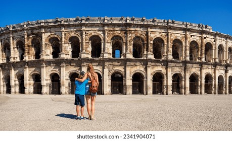 Family traveling in France- Nimes city with ancient amphitheatre- Gard, Occitanie region - Shutterstock ID 2341904071