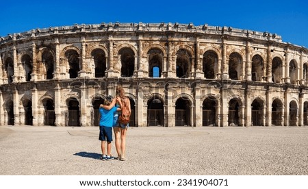 Family traveling in France- Nimes city with ancient amphitheatre- Gard, Occitanie region