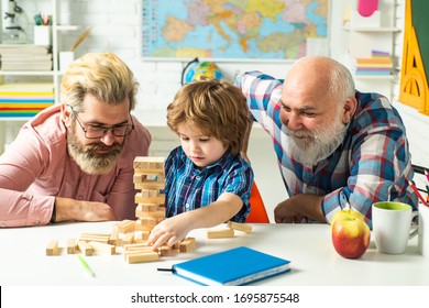 Family tree. Pupil with father and grandfather enjoying together at home. Excited teach. Three different generations ages: grandfather father and child son together - Shutterstock ID 1695875548