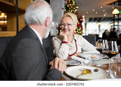 Family of two having a Christmas dinner at the bar - Powered by Shutterstock