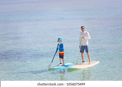 Family Of Two, Little Boy And Young Father, Enjoying Stand Up Paddleboarding Together At Fiji, Active Family Vacation Concept