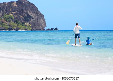 Family Of Two, Little Boy And Young Father, Enjoying Stand Up Paddleboarding Together At Fiji, Active Family Vacation Concept