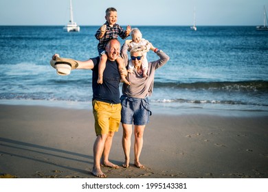 The Family With Two Small Boys Enjoying Time On The Beach, Algarve, Portugal