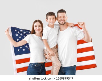 Family with USA flag on light background. Memorial Day celebration