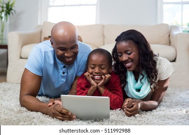 Family using digital tablet at home