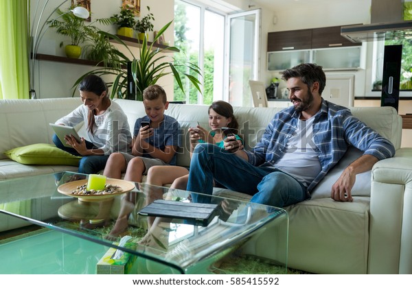 Family Using Laptop Mobile Phone Living Stock Photo Edit Now