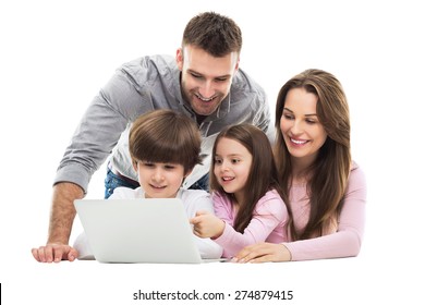 Family using laptop together
