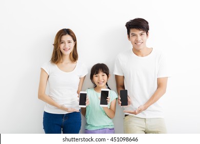 Family Using Smart Phones While Standing Together