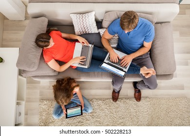 Family Using Tablet And Computers