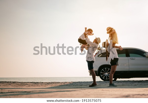 Family\
vacation holiday,Happy family, parents holding children flying in\
the sky.Concept family and Holiday and\
travel.