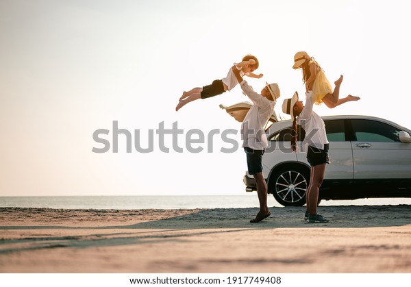 Family\
vacation holiday,Happy family, parents holding children flying in\
the sky.Concept family and Holiday and\
travel.