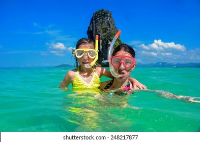 Family Vacation, Mother And Kid Snorkeling In Sea In Thailand 