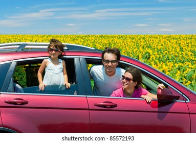 Family Vacation. Parents With Child In Car Trip