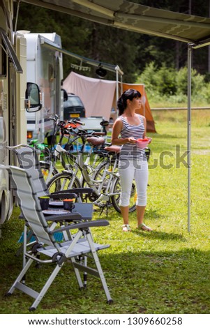 Similar – Image, Stock Photo Woman walking up ladder to tent over car