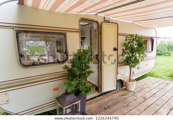 Family vacation travel, vacation trip to the\
motorhome, vacation Caravan car. Equipped place for camping.\
Motorhome trailer.
