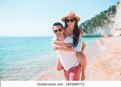 Family vacation. Young couple enjoy beach holiday