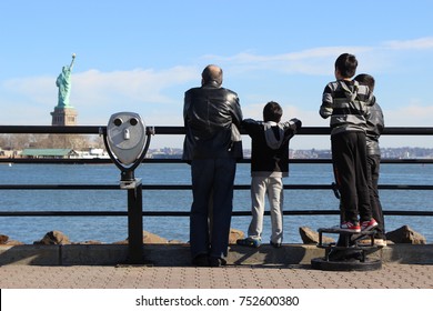 Family Views Statue Of Liberty