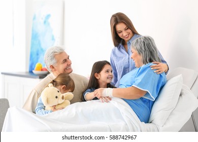Family visiting grandmother in hospital
