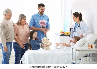 Family visiting little girl in hospital