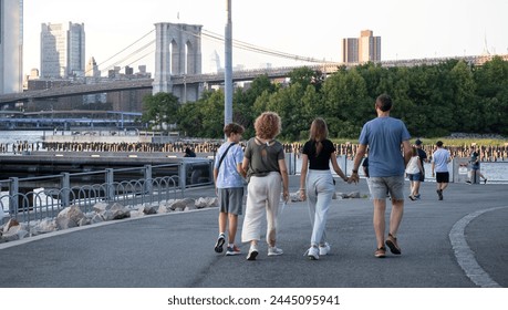 Family Walk Along the Brooklyn Bridge Park at Dusk - Powered by Shutterstock