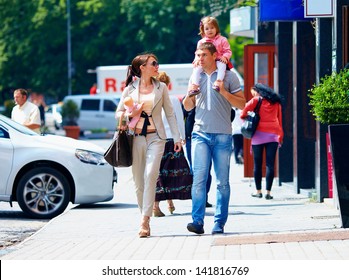 Family Walking The City Street, Casual Lifestyle