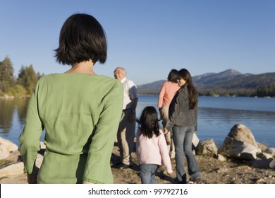 Family Walking At Lake