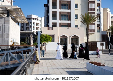 Family Walking In The Marina In Al Mouj, The Wave, Muscat, Oman. September 7, 2020.