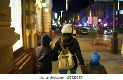 Family Walking In Night City