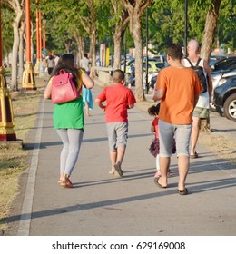 Family Walking In Park