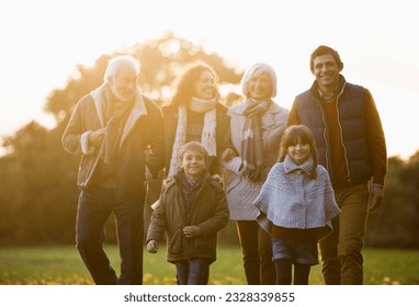 Family walking together in park - Powered by Shutterstock