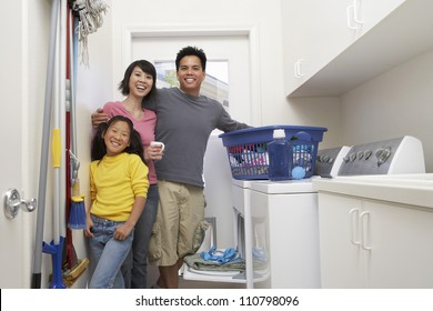 Family Washing Clothes At Home